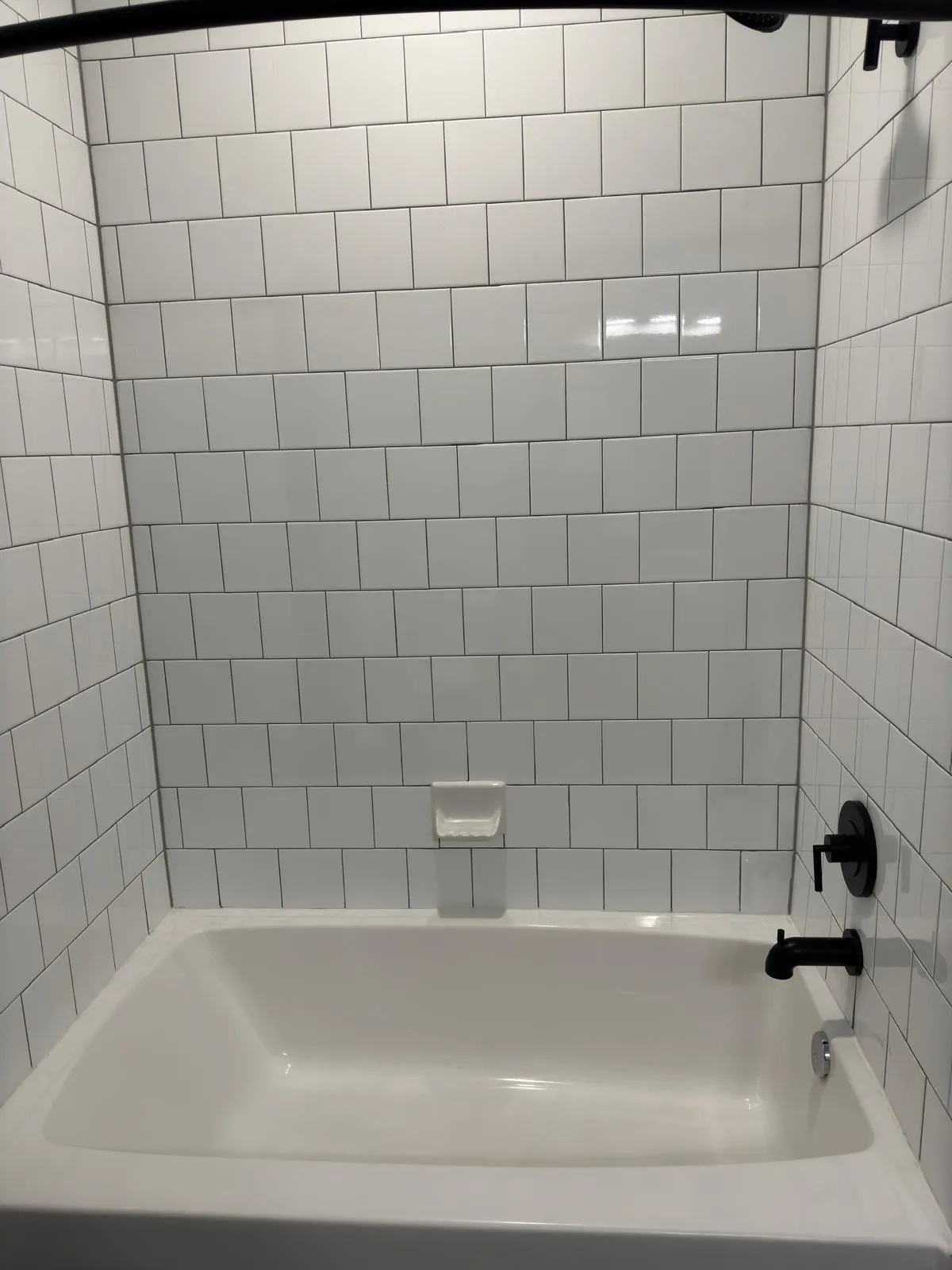 Tub and grout restored — real LOOM cleaning work
